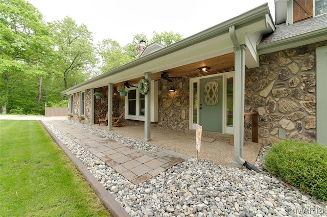 view of patio featuring ceiling fan