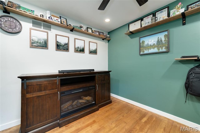 bar area featuring baseboards, light wood-style flooring, a ceiling fan, and recessed lighting