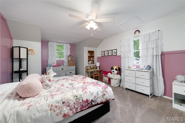 carpeted bedroom featuring lofted ceiling and a ceiling fan