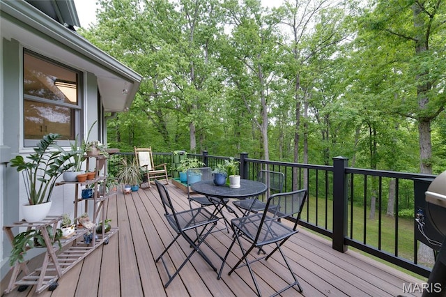 wooden deck featuring outdoor dining space