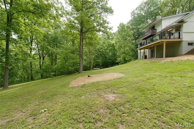 view of grassy yard featuring a deck
