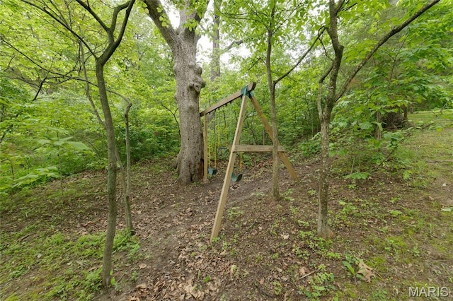 view of play area with a wooded view