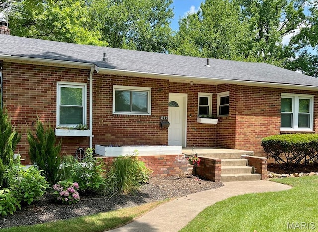 852 Madison Ave, Edwardsville, IL 62025 - ranch-style house featuring brick siding, a shingled roof, and a chimney