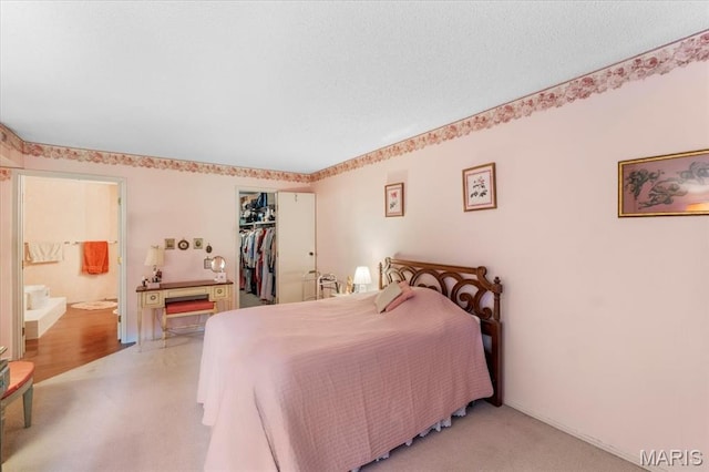 572 Coeur De Royale Dr Unit 105, Saint Louis, MO 63141 - bedroom with a closet, light colored carpet, and ensuite bathroom