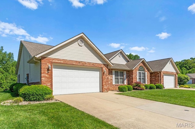 view of front of home with a garage, brick siding, concrete driveway, a front yard, and a shingled roof
