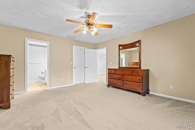 bedroom with carpet floors, baseboards, and connected bathroom