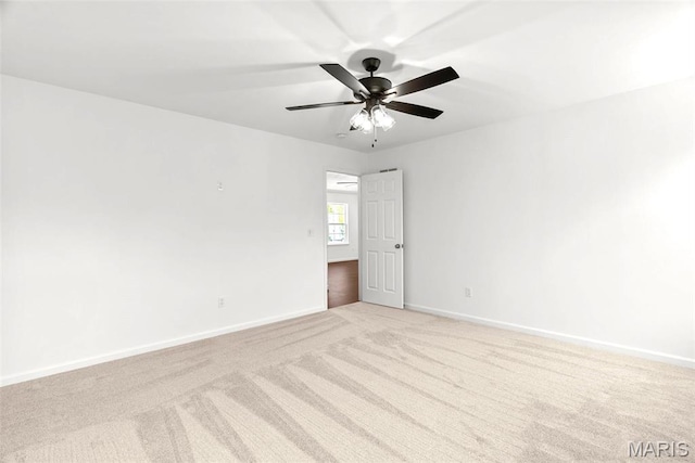 1909 Magnolia Way, Pevely, MO 63070 - carpeted spare room featuring baseboards and a ceiling fan