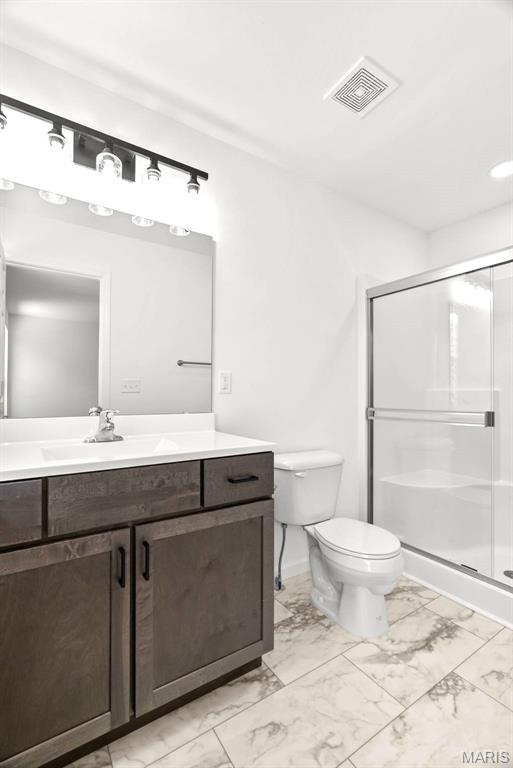 1909 Magnolia Way, Pevely, MO 63070 - bathroom with marble finish floors, vanity, and a shower stall