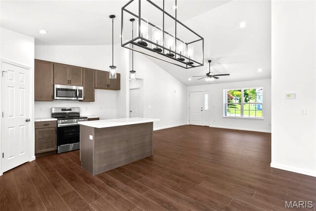 1909 Magnolia Way, Pevely, MO 63070 - kitchen featuring stainless steel appliances, ceiling fan, high vaulted ceiling, light countertops, and decorative light fixtures