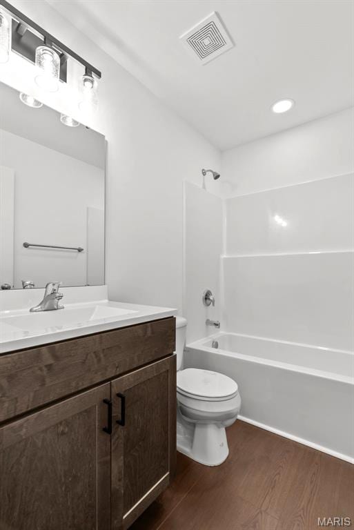 1909 Magnolia Way, Pevely, MO 63070 - bathroom with wood finished floors, vanity, and washtub / shower combination