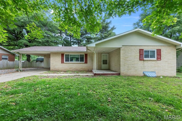 804 Harvard St, Sikeston, MO 63801 - single story home with brick siding, concrete driveway, and an attached carport