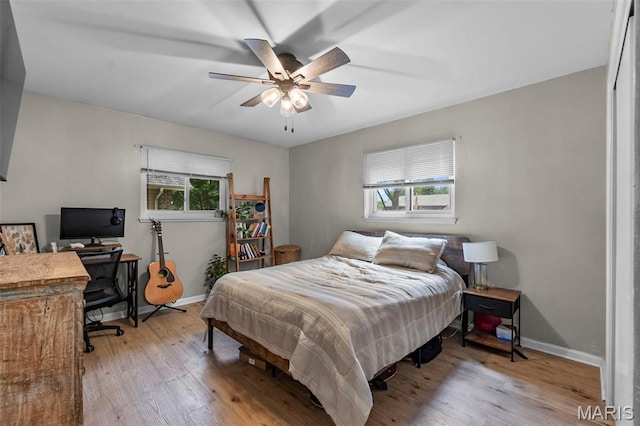 804 Harvard St, Sikeston, MO 63801 - bedroom featuring wood finished floors, baseboards, ceiling fan, and an office area
