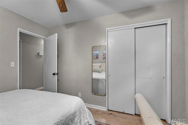 804 Harvard St, Sikeston, MO 63801 - bedroom featuring wood finished floors, a ceiling fan, a closet, and baseboards
