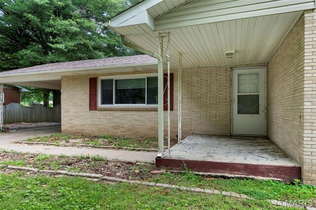 804 Harvard St, Sikeston, MO 63801 - property entrance with brick siding and fence