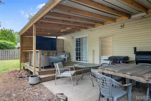 804 Harvard St, Sikeston, MO 63801 - view of patio with outdoor dining area, fence, and grilling area