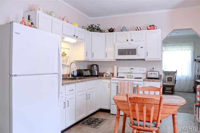 205 Watts St, Park Hills, MO 63601 - kitchen with white appliances, a sink, white cabinetry, crown molding, and arched walkways