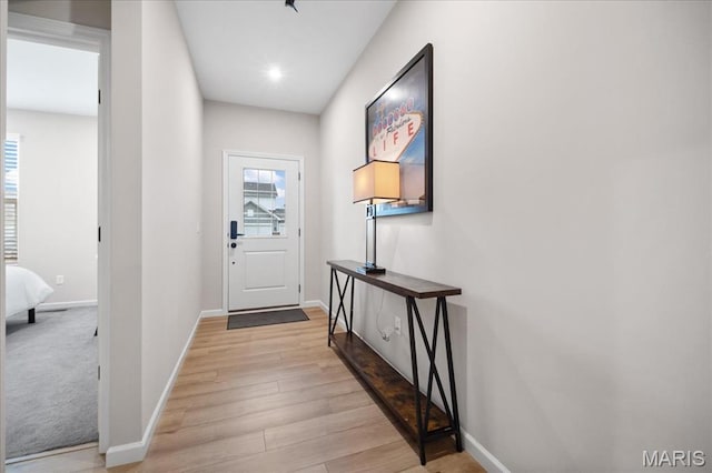 719 Myatt Dr, Wentzville, MO 63385 - doorway to outside with baseboards and light wood-type flooring