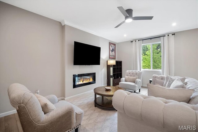 719 Myatt Dr, Wentzville, MO 63385 - living room featuring a glass covered fireplace, recessed lighting, and a ceiling fan