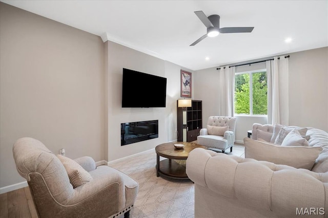 719 Myatt Dr, Wentzville, MO 63385 - living room featuring recessed lighting, a glass covered fireplace, and a ceiling fan