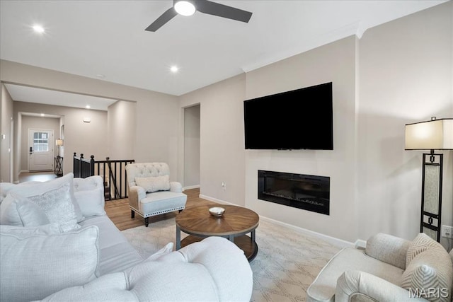 719 Myatt Dr, Wentzville, MO 63385 - living area featuring ceiling fan, recessed lighting, and a glass covered fireplace