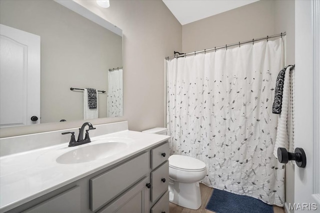 719 Myatt Dr, Wentzville, MO 63385 - full bathroom featuring vanity, wood finished floors, and a shower with curtain