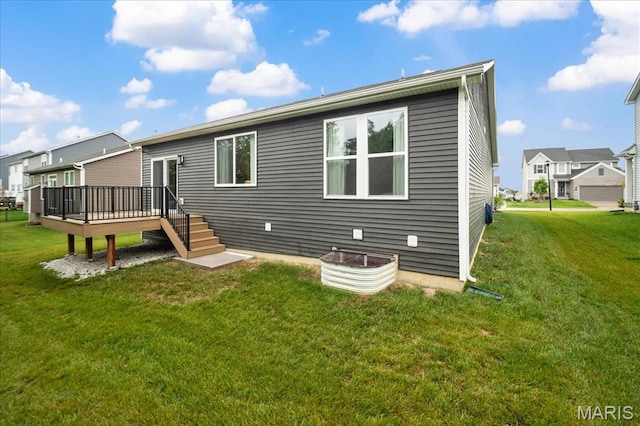 719 Myatt Dr, Wentzville, MO 63385 - back of house with a wooden deck, a yard, and a residential view