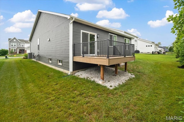 719 Myatt Dr, Wentzville, MO 63385 - back of property featuring a wooden deck and a lawn