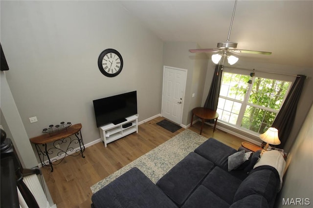 1209 Hunters Chase Dr, Eureka, MO 63025 - living room with wood finished floors, ceiling fan, and baseboards