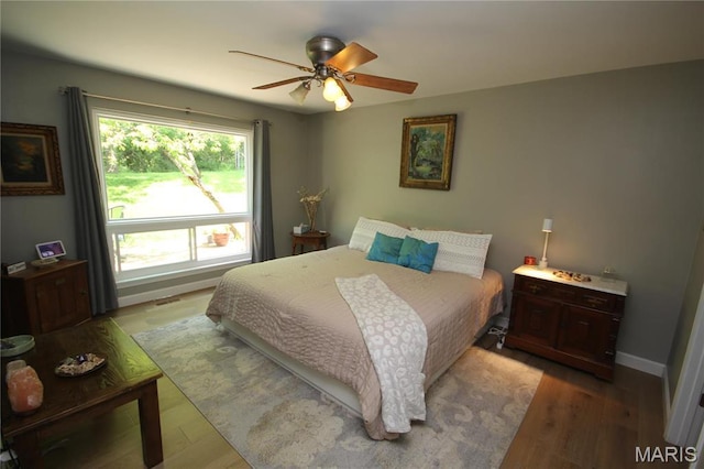1209 Hunters Chase Dr, Eureka, MO 63025 - bedroom featuring wood finished floors, baseboards, and ceiling fan