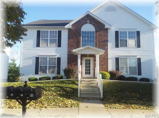 view of front of property featuring brick siding