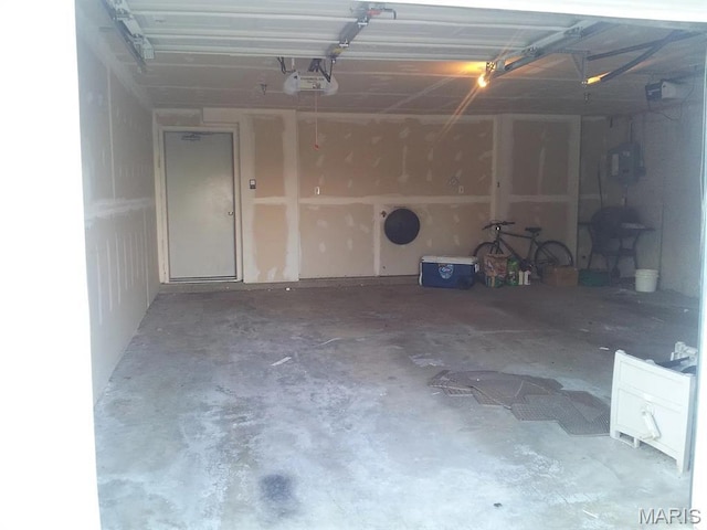 14 Homefield Gardens Dr Unit 19N, Ofallon, MO 63366 - garage featuring a garage door opener
