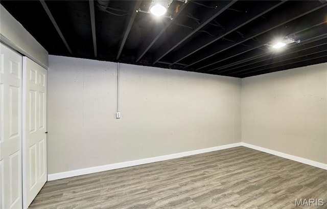finished basement with wood finished floors and baseboards