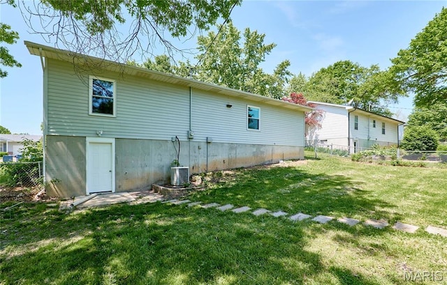rear view of property featuring central air condition unit