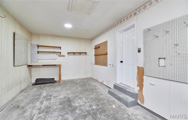 interior space featuring unfinished concrete flooring