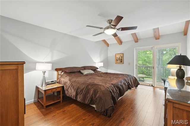 bedroom with access to outside, wood finished floors, and ceiling fan