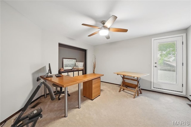 office with light colored carpet, ceiling fan, and baseboards