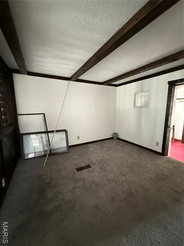 226 Dixie St, Sikeston, MO 63801 - bonus room with carpet, beamed ceiling, a textured ceiling, and baseboards