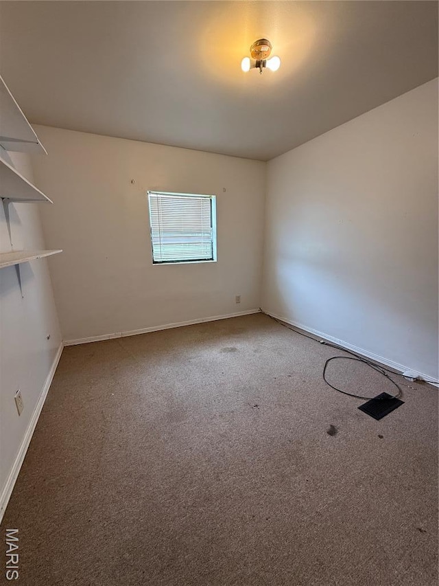 226 Dixie St, Sikeston, MO 63801 - empty room with carpet and baseboards