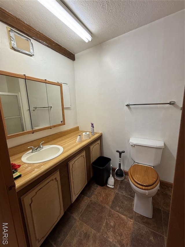 226 Dixie St, Sikeston, MO 63801 - bathroom with toilet, a textured ceiling, and vanity
