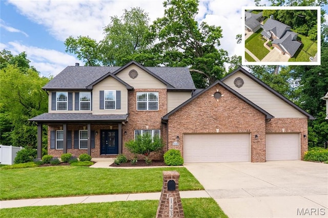1438 Arbor Green Trl, Ofallon, IL 62269 - view of front of home featuring driveway, an attached garage, brick siding, and roof with shingles
