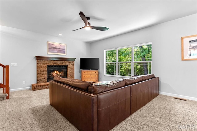 1438 Arbor Green Trl, Ofallon, IL 62269 - living area featuring carpet flooring, ceiling fan, baseboards, a fireplace, and stairway