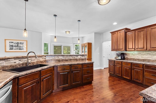 1438 Arbor Green Trl, Ofallon, IL 62269 - kitchen with a sink, dishwasher, tasteful backsplash, dark wood finished floors, and decorative light fixtures