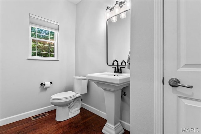 1438 Arbor Green Trl, Ofallon, IL 62269 - half bathroom featuring baseboards, wood finished floors, and toilet