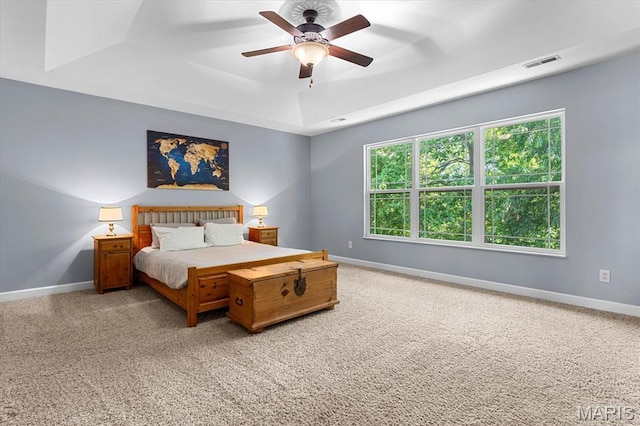 1438 Arbor Green Trl, Ofallon, IL 62269 - carpeted bedroom featuring a raised ceiling, baseboards, and a ceiling fan