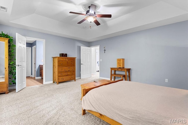 1438 Arbor Green Trl, Ofallon, IL 62269 - bedroom with a tray ceiling, light colored carpet, baseboards, and ceiling fan