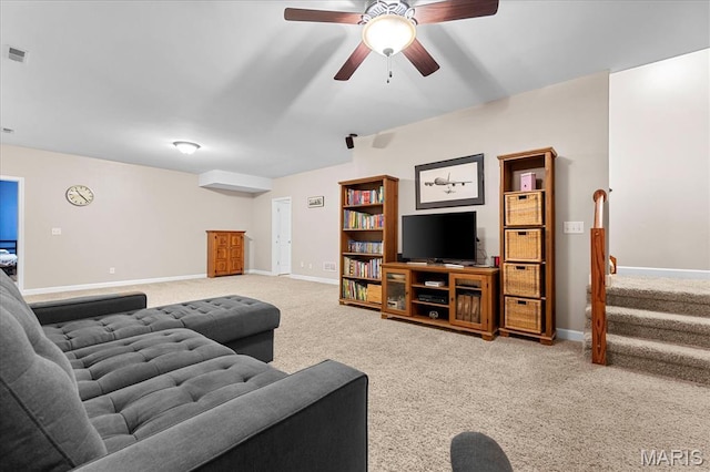 1438 Arbor Green Trl, Ofallon, IL 62269 - living room featuring carpet, baseboards, a ceiling fan, and stairway