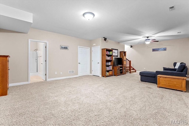 1438 Arbor Green Trl, Ofallon, IL 62269 - living room featuring carpet floors, ceiling fan, baseboards, and stairway