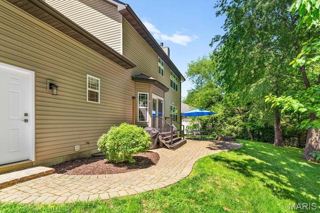 1438 Arbor Green Trl, Ofallon, IL 62269 - view of grassy yard featuring a patio