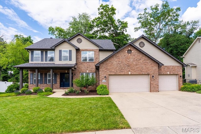 1438 Arbor Green Trl, Ofallon, IL 62269 - view of front of property featuring driveway, a front yard, a garage, brick siding, and central AC unit