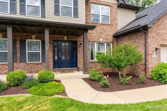 1438 Arbor Green Trl, Ofallon, IL 62269 - view of exterior entry featuring brick siding and covered porch